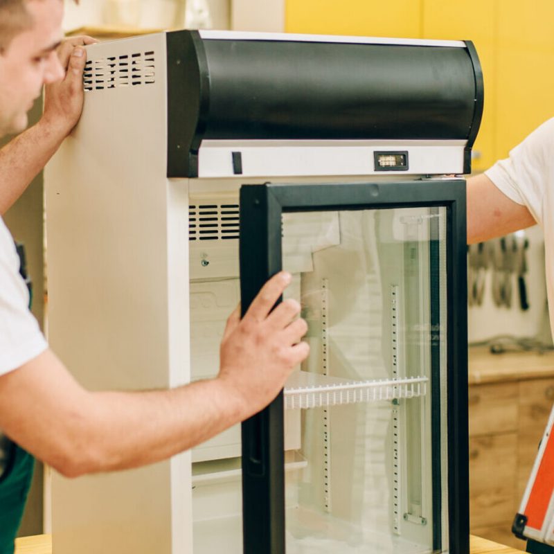 male-workers-in-uniform-repair-refrigerator-2024-11-27-01-47-58-utc-scaled.jpg